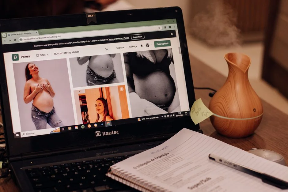 A modern computer screen displaying web design work, showcasing creative visuals in a workspace.